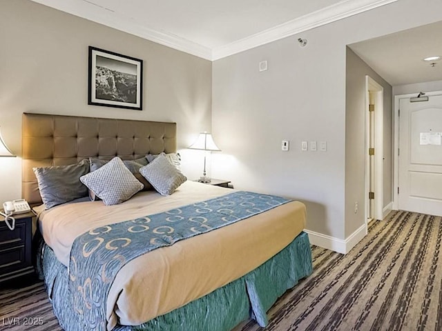 bedroom featuring hardwood / wood-style flooring and crown molding