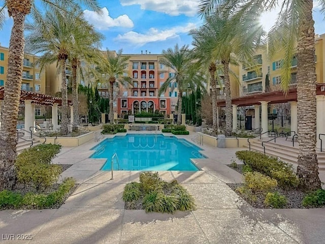 view of swimming pool with a patio area