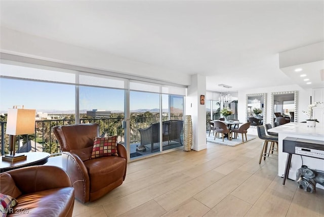 living room featuring floor to ceiling windows