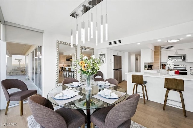 dining room featuring light hardwood / wood-style flooring