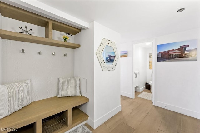 mudroom with light hardwood / wood-style flooring