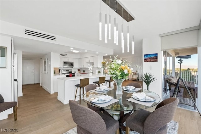 dining area featuring light hardwood / wood-style flooring