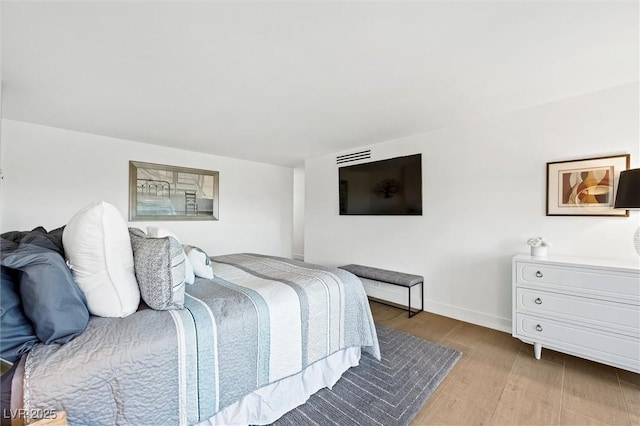 bedroom featuring light wood-type flooring