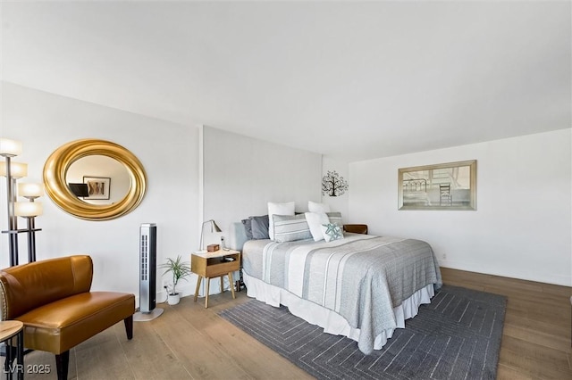 bedroom with hardwood / wood-style flooring