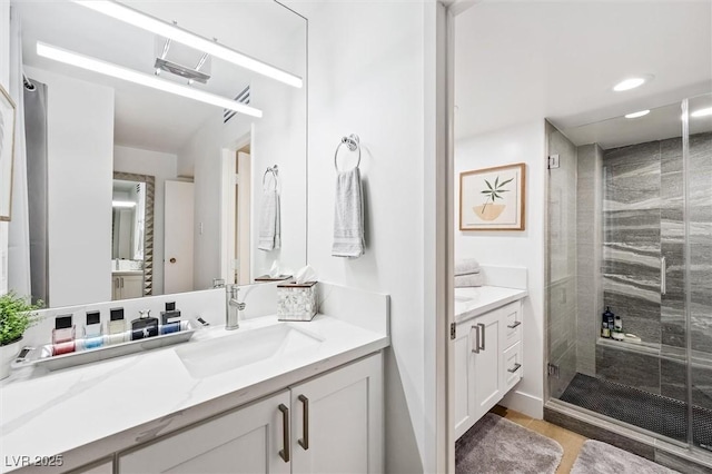 bathroom featuring vanity, tile patterned floors, and an enclosed shower