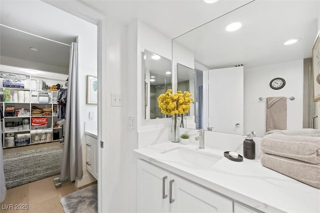 bathroom with vanity and wood-type flooring