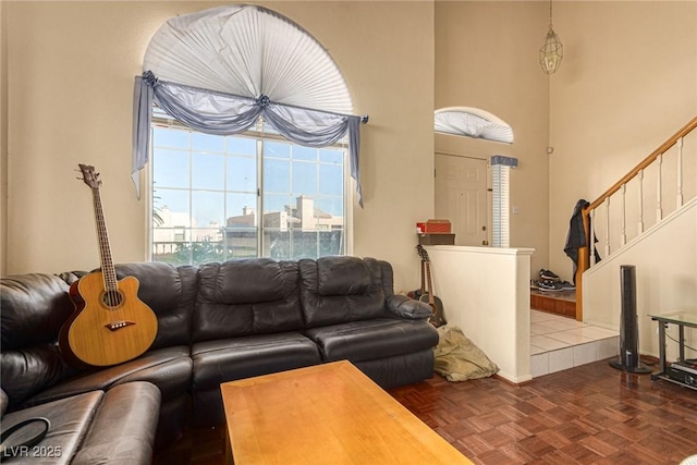 living room featuring dark parquet floors