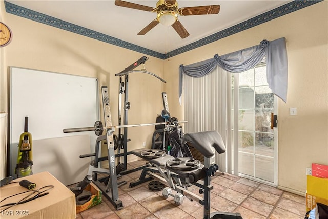 workout room featuring light tile patterned floors and ceiling fan