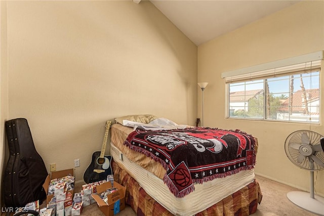 carpeted bedroom featuring lofted ceiling