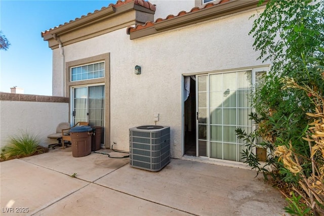 exterior space featuring central AC unit