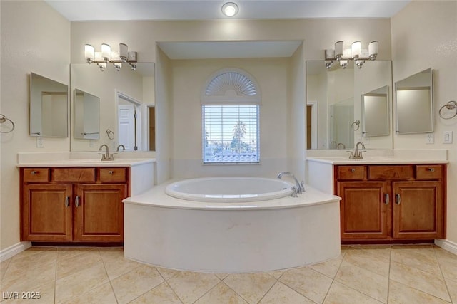 bathroom featuring a bathtub, an inviting chandelier, and tile patterned floors