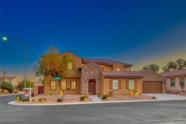 mediterranean / spanish-style house featuring a garage