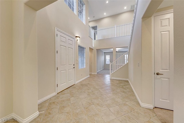 entryway with a high ceiling