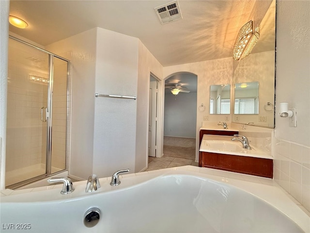 bathroom featuring tile patterned floors, ceiling fan, vanity, and shower with separate bathtub