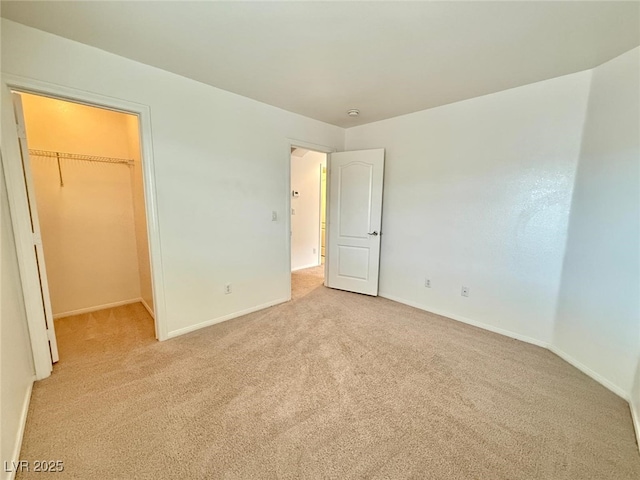 unfurnished room with light carpet