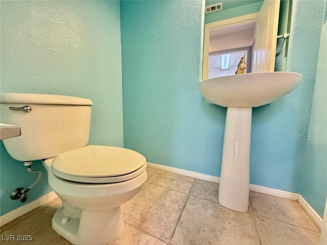 bathroom featuring toilet