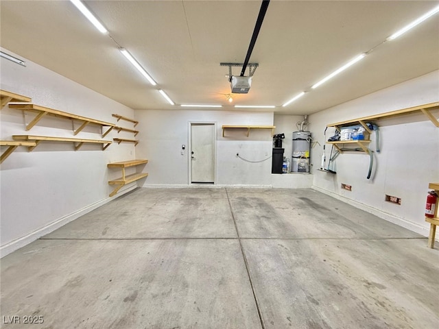 garage with a garage door opener and water heater