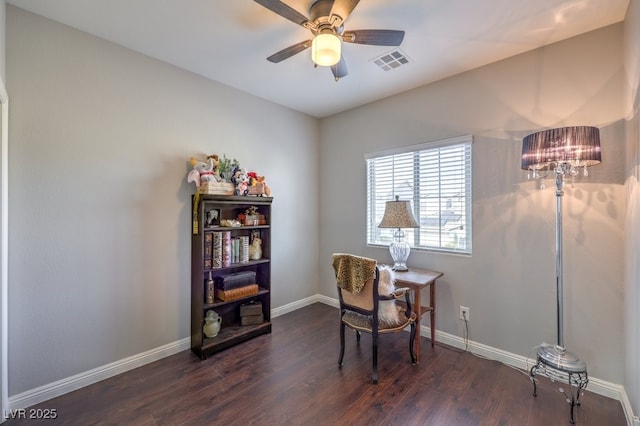 home office featuring dark wood-type flooring and ceiling fan