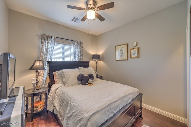 bedroom featuring ceiling fan and dark hardwood / wood-style flooring