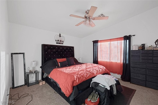 bedroom with ceiling fan, lofted ceiling, and light carpet