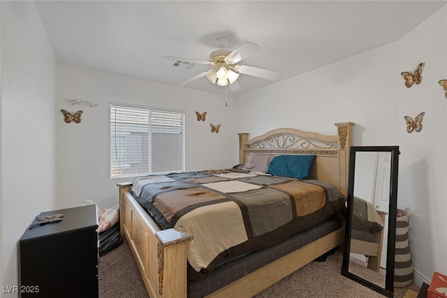 bedroom featuring ceiling fan and dark colored carpet