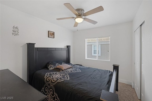 carpeted bedroom with ceiling fan and a closet