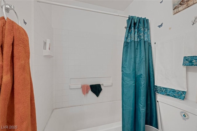 bathroom featuring toilet and shower / tub combo