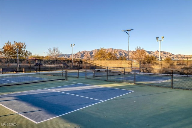 view of sport court with a mountain view