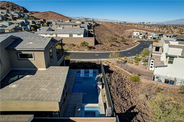 birds eye view of property with a mountain view