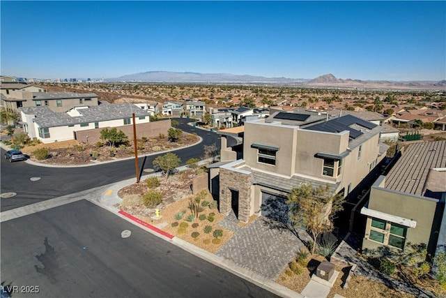 birds eye view of property featuring a mountain view