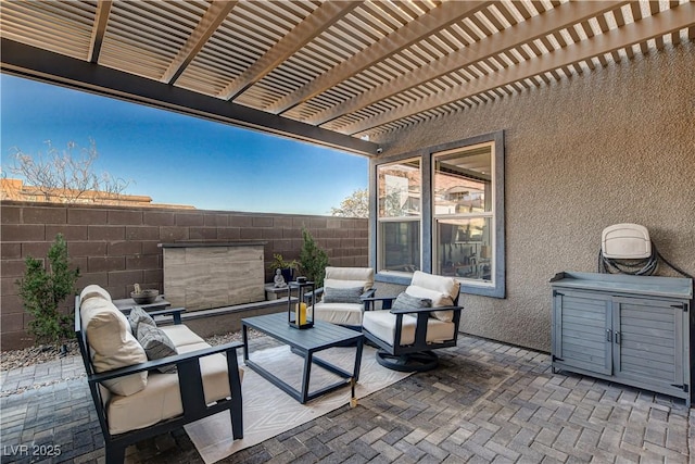 view of patio featuring a pergola and an outdoor hangout area