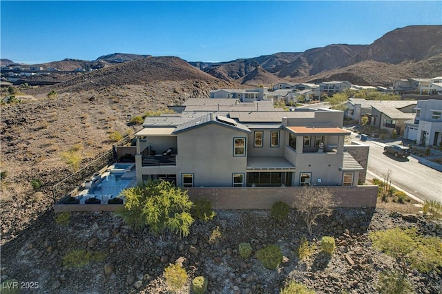 birds eye view of property featuring a mountain view