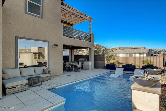 view of pool featuring outdoor lounge area, area for grilling, and a patio area