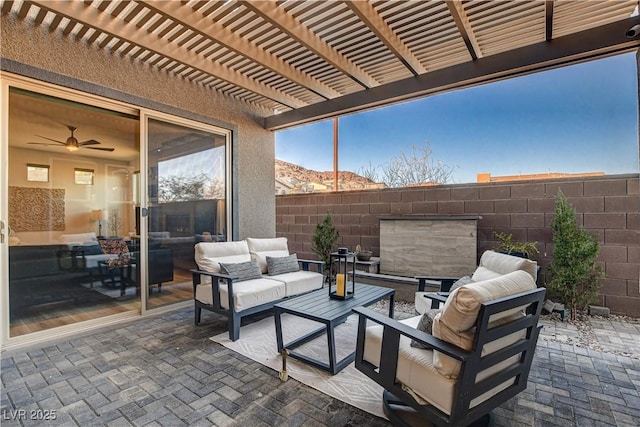 view of patio / terrace featuring an outdoor living space and a pergola