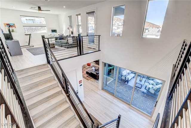 stairway featuring hardwood / wood-style floors