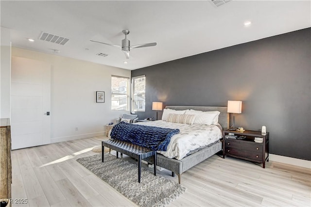 bedroom with light hardwood / wood-style flooring and ceiling fan