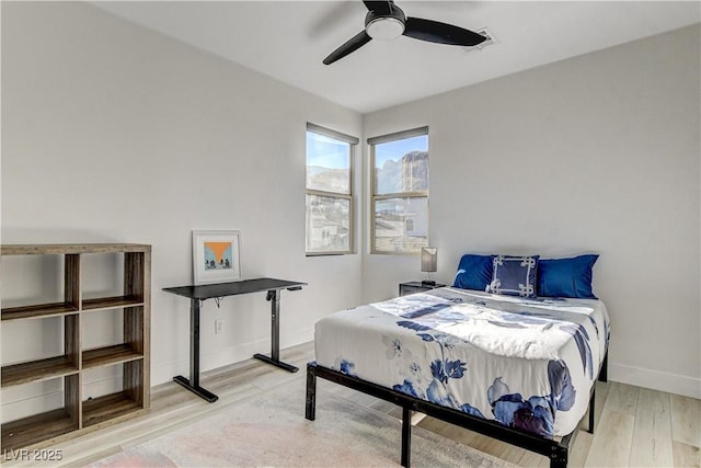 bedroom featuring hardwood / wood-style floors and ceiling fan