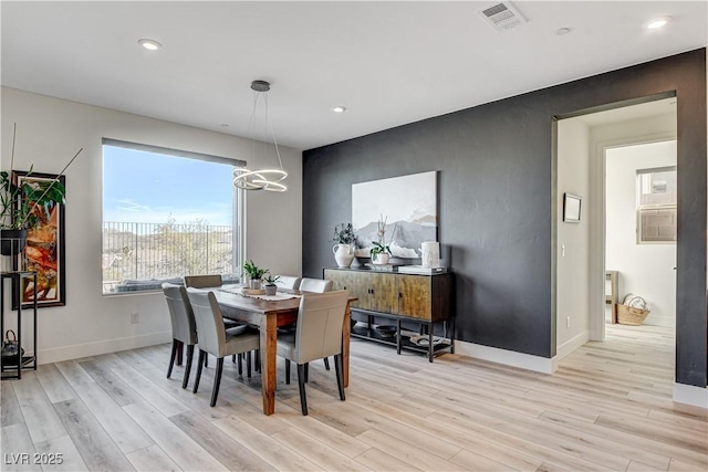 dining room with light wood-type flooring