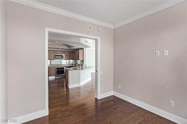 unfurnished room with ornamental molding and dark hardwood / wood-style floors