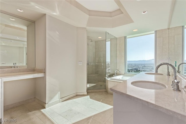 bathroom with vanity, a shower with door, and tile patterned floors