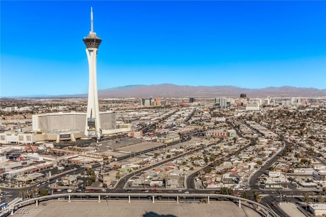 birds eye view of property with a mountain view