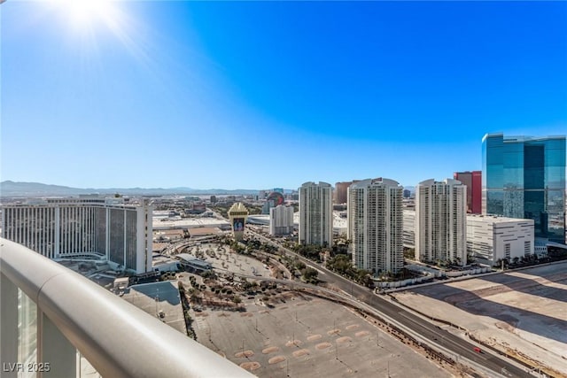 property's view of city with a mountain view