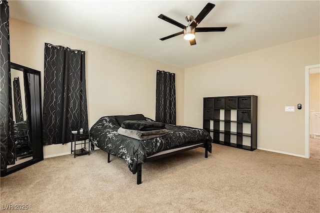 bedroom featuring ceiling fan and light colored carpet