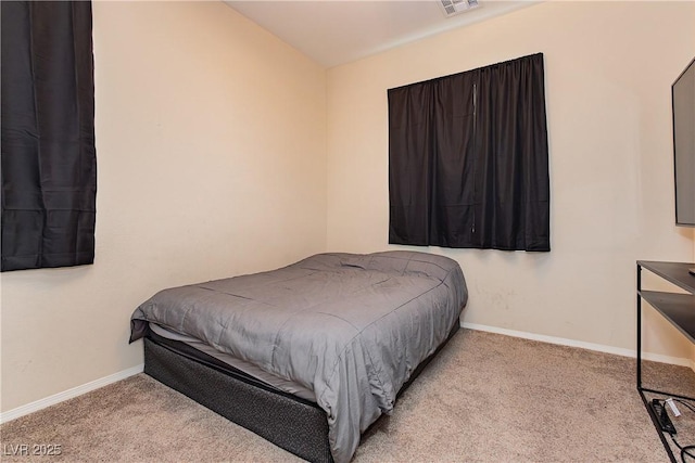 carpeted bedroom with vaulted ceiling