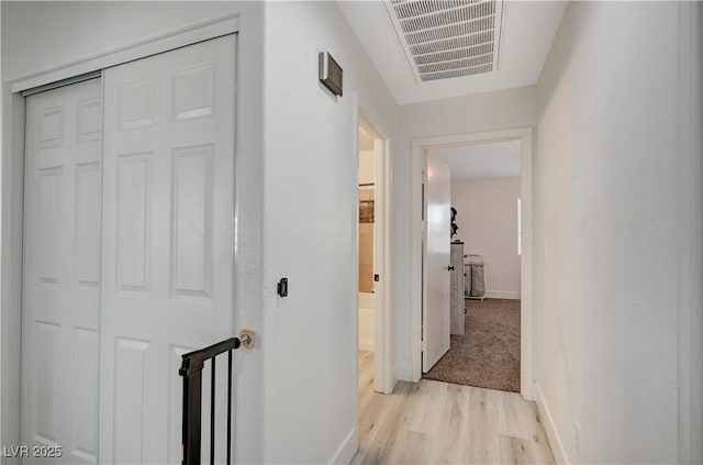 hallway featuring light wood-type flooring