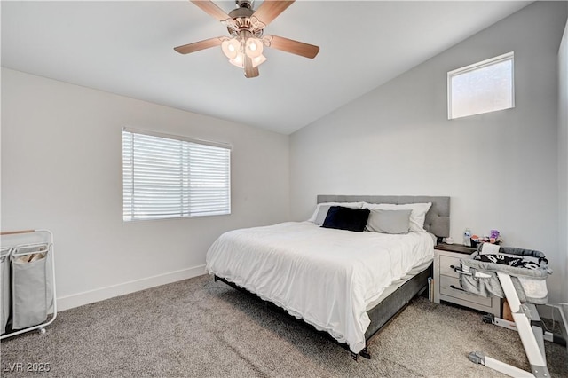 carpeted bedroom with ceiling fan and vaulted ceiling