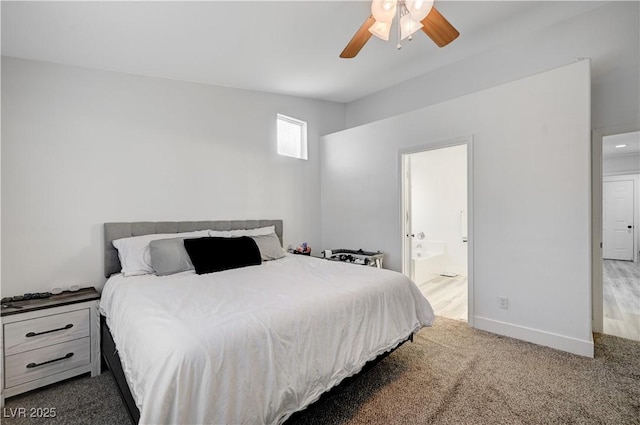 bedroom featuring dark colored carpet, ensuite bathroom, and ceiling fan