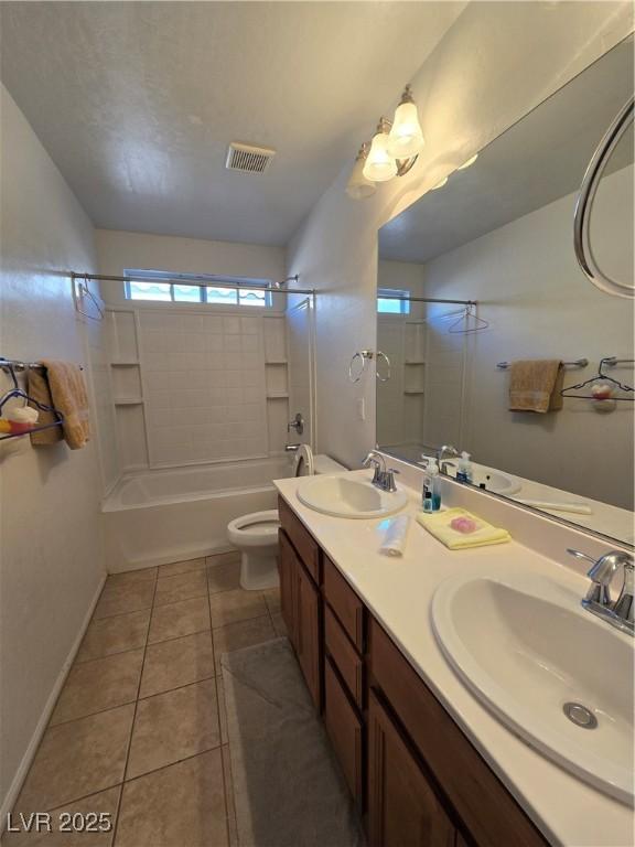 full bathroom with tile patterned flooring, vanity, toilet, and bathtub / shower combination