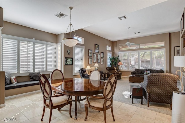 dining room featuring light tile patterned floors and ceiling fan