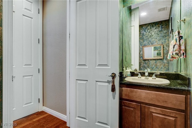 bathroom featuring hardwood / wood-style floors and vanity